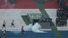 Police fire rubber bullets and detain dozens as Paraguay derby abandoned